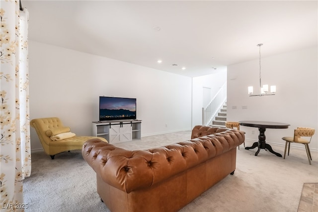 living room with baseboards, stairway, a chandelier, and light colored carpet