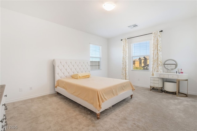 bedroom with baseboards, visible vents, and carpet flooring