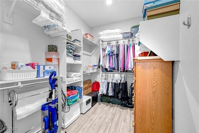 spacious closet with wood finished floors