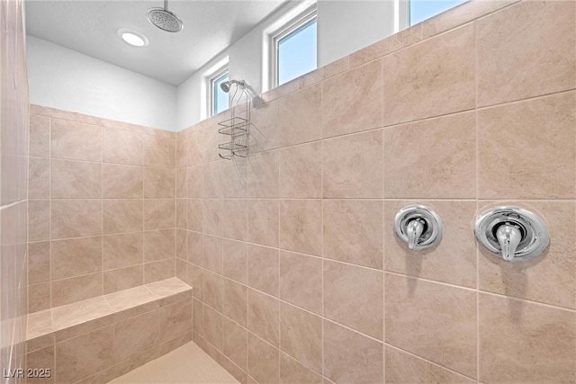 full bath featuring a tile shower