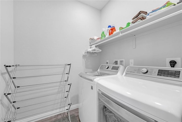 clothes washing area featuring laundry area and washing machine and dryer