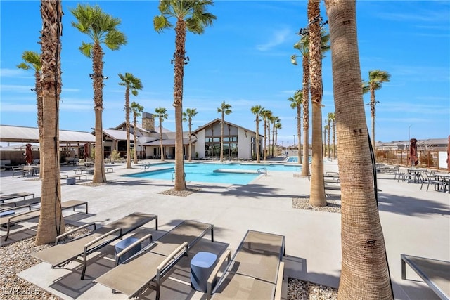 community pool with a patio area