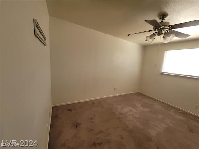 unfurnished room with carpet floors, baseboards, and a ceiling fan