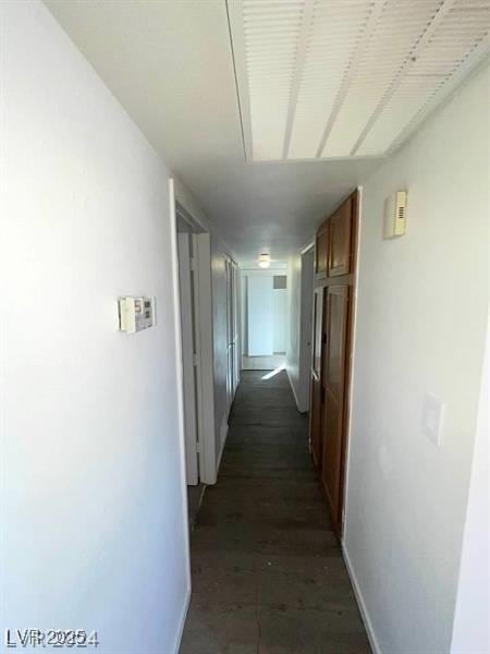 corridor featuring baseboards