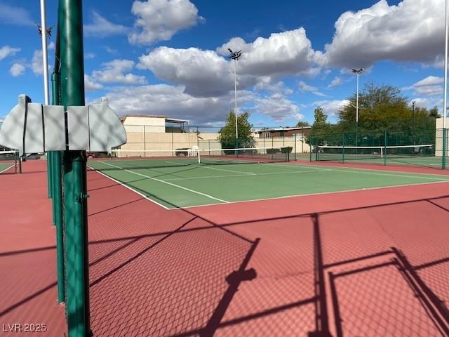 view of sport court with fence