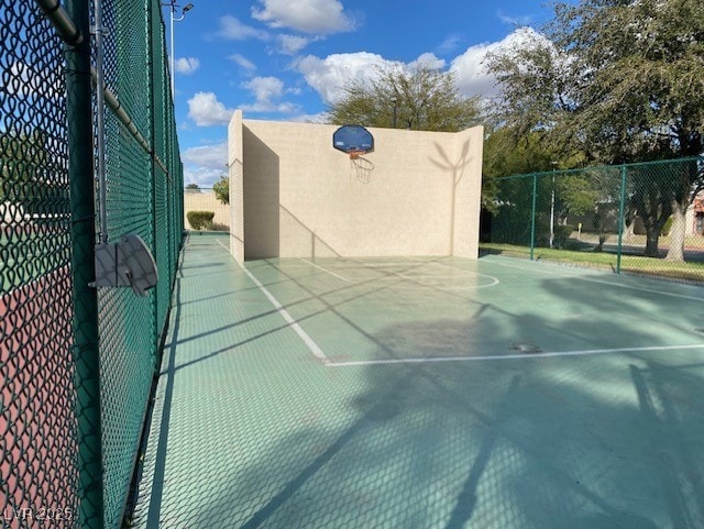 view of sport court featuring community basketball court and fence