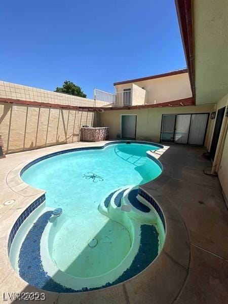 view of pool with a fenced in pool