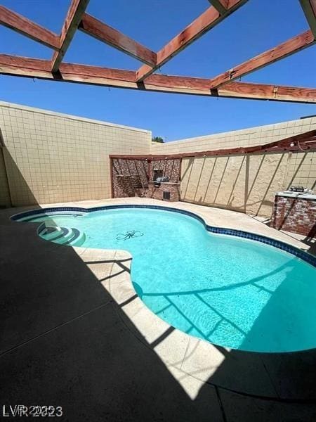 view of pool with a fenced in pool, a patio area, and a fenced backyard