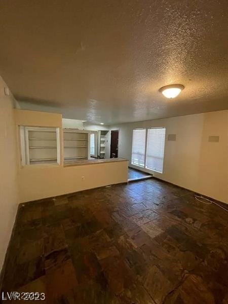 empty room with a textured ceiling