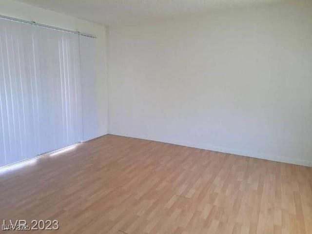 empty room with light wood finished floors