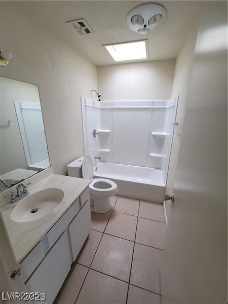 full bathroom featuring visible vents, toilet, tub / shower combination, vanity, and tile patterned floors