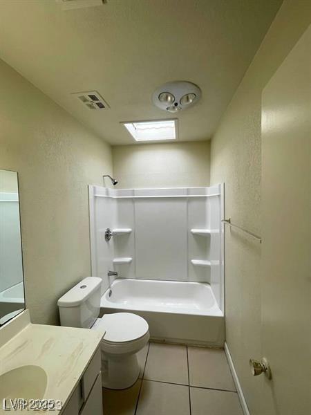 full bathroom featuring visible vents, bathing tub / shower combination, toilet, tile patterned flooring, and vanity