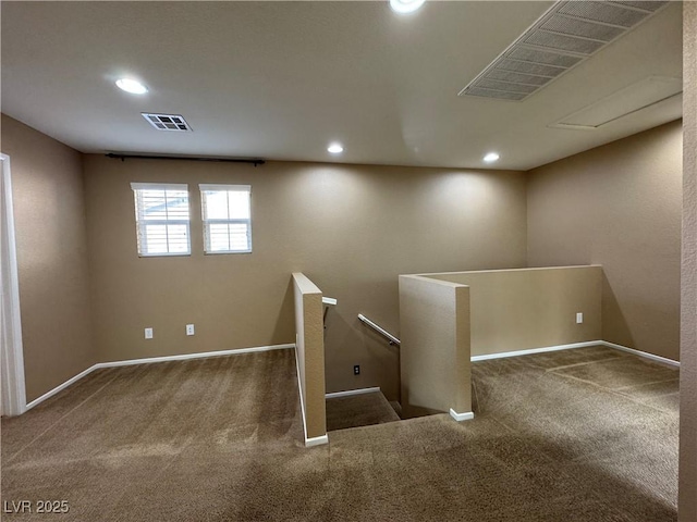 interior space with carpet, visible vents, baseboards, and recessed lighting