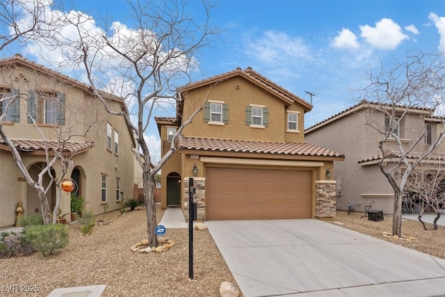 mediterranean / spanish house featuring stucco siding, a tile roof, stone siding, concrete driveway, and a garage