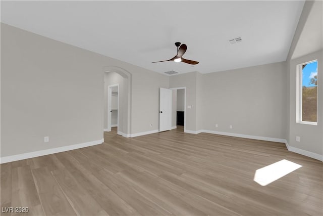 unfurnished room featuring light wood-style floors, baseboards, and visible vents