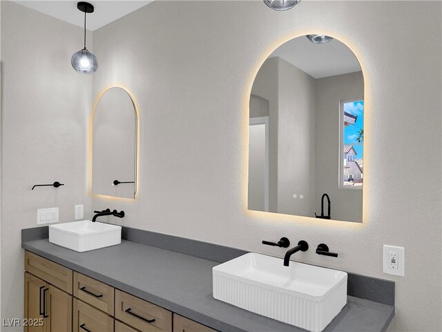 bathroom with double vanity and a sink