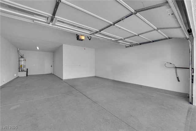 garage featuring water heater and a garage door opener