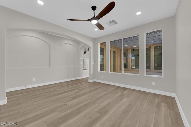 unfurnished room featuring light wood-style flooring, recessed lighting, a ceiling fan, visible vents, and baseboards