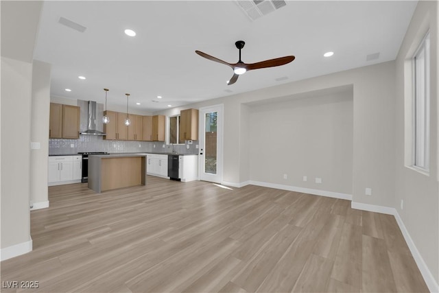 unfurnished living room featuring light wood-style floors, recessed lighting, visible vents, and baseboards