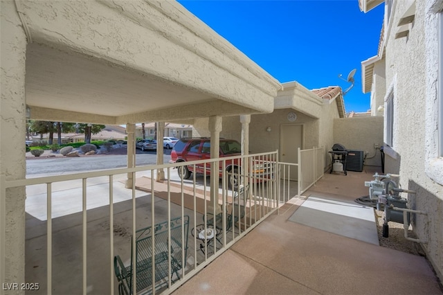 view of patio / terrace with a balcony