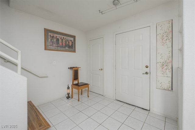 entryway with light tile patterned flooring