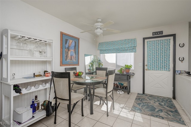 dining room featuring ceiling fan and light tile patterned flooring