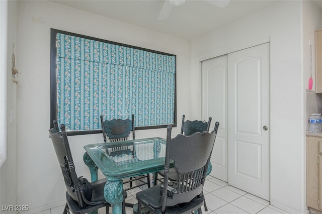 dining area featuring ceiling fan and light tile patterned flooring