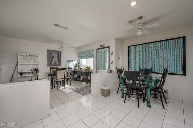 dining room with ceiling fan, light tile patterned floors, and visible vents