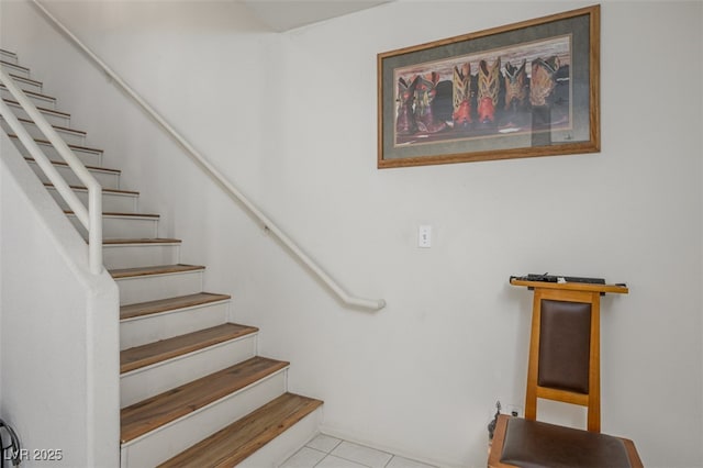 staircase with tile patterned flooring