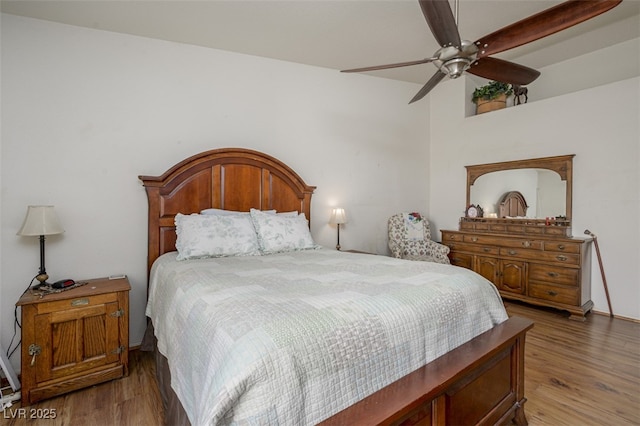 bedroom featuring ceiling fan and wood finished floors