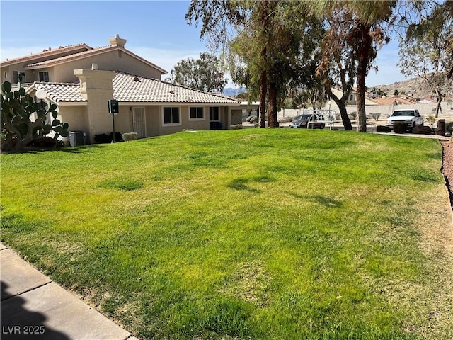 view of yard featuring central AC