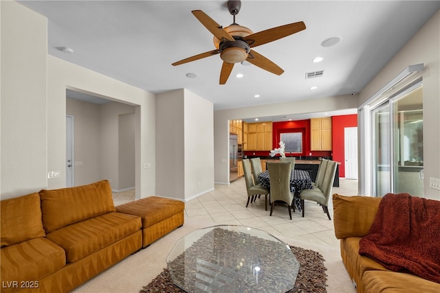 living room featuring visible vents, baseboards, a ceiling fan, light tile patterned flooring, and recessed lighting