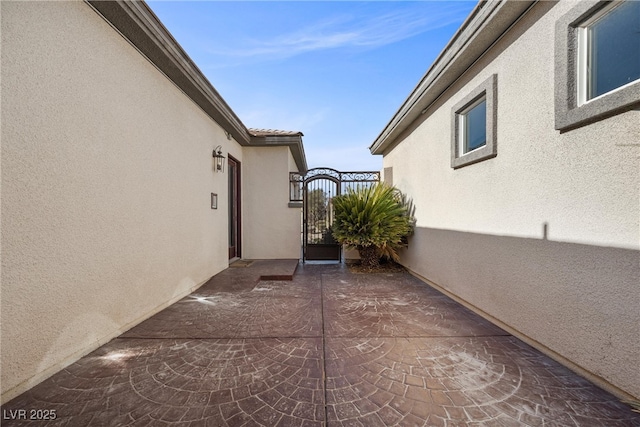 view of patio / terrace with a gate