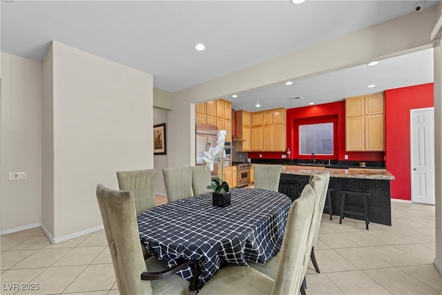 dining room featuring light tile patterned floors, baseboards, and recessed lighting