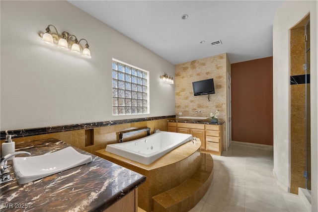 full bath featuring a bath, tile patterned flooring, vanity, and visible vents