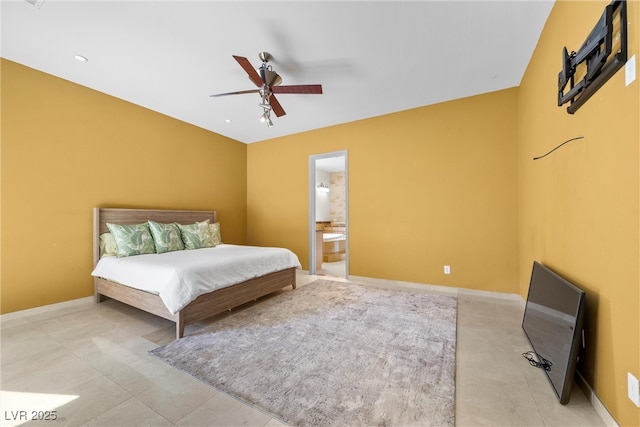 bedroom featuring ceiling fan, baseboards, and connected bathroom