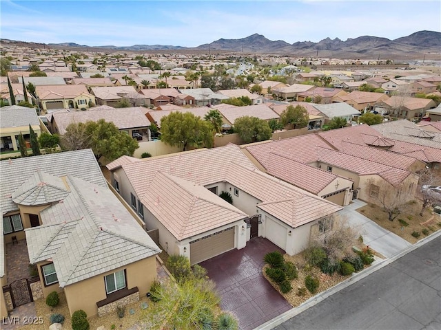 drone / aerial view with a mountain view and a residential view