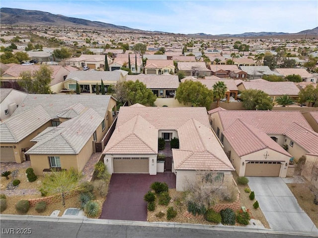 aerial view featuring a mountain view and a residential view