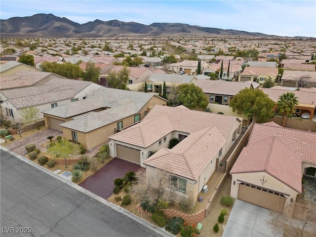 birds eye view of property featuring a mountain view and a residential view