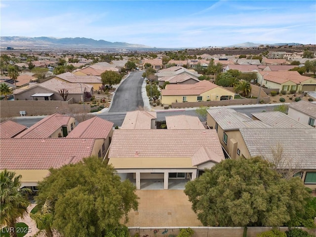 bird's eye view with a residential view and a mountain view