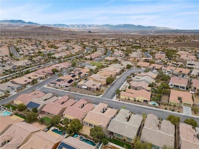 drone / aerial view featuring a residential view and a mountain view