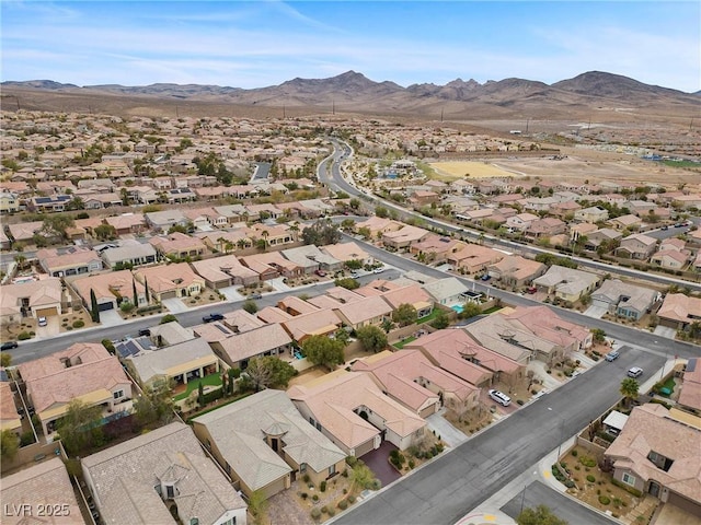 birds eye view of property with a mountain view and a residential view