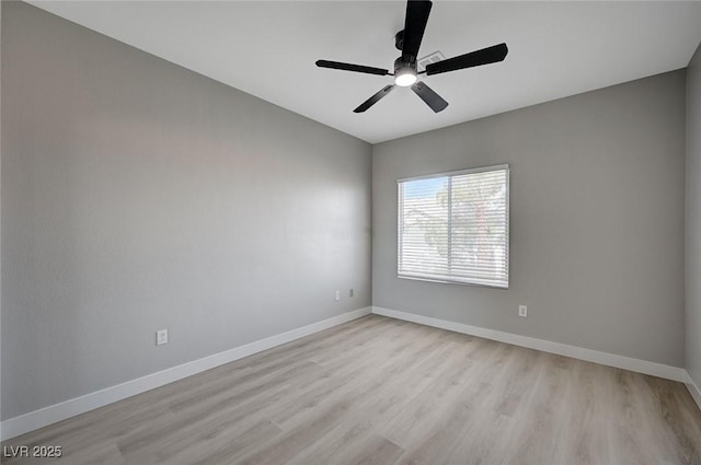 unfurnished room with light wood-type flooring, ceiling fan, and baseboards