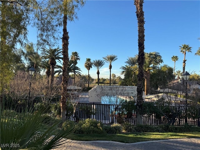 view of gate with fence