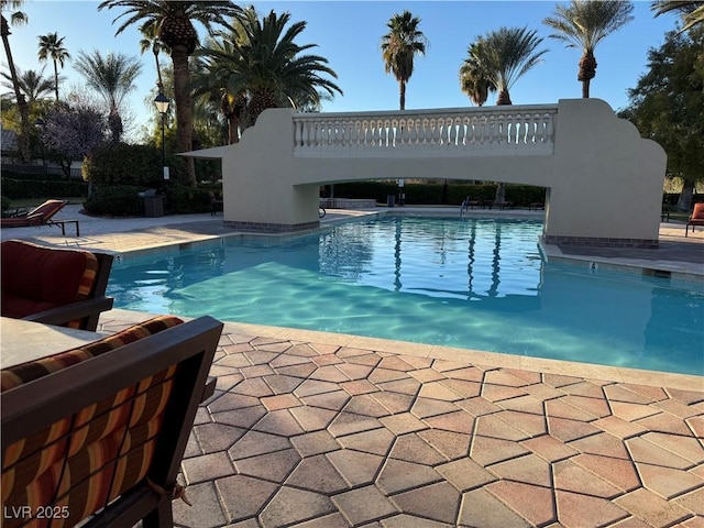 community pool featuring a patio area