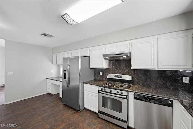 kitchen featuring visible vents, white cabinets, decorative backsplash, stainless steel appliances, and under cabinet range hood