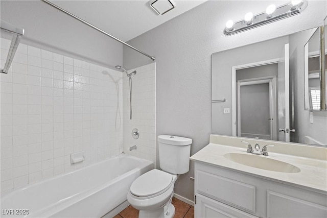 bathroom with vanity, shower / washtub combination, tile patterned flooring, and toilet