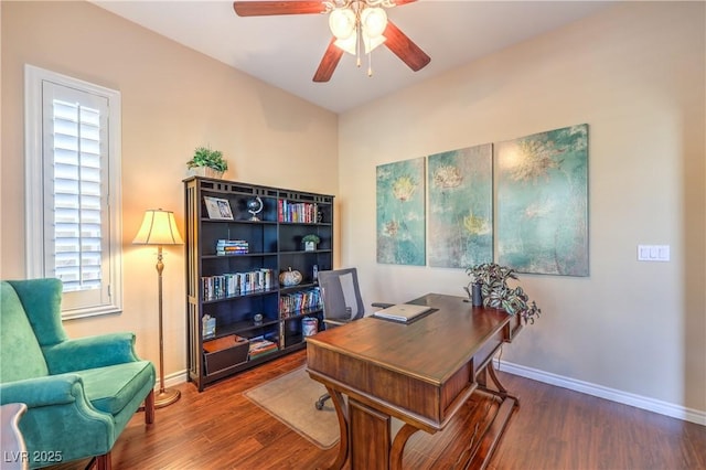 office space with ceiling fan, baseboards, and wood finished floors