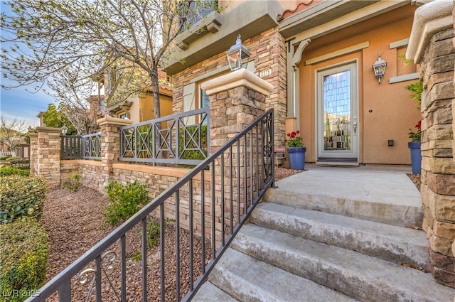 entrance to property featuring stone siding