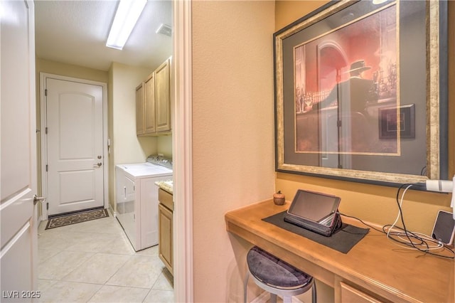 laundry room with cabinet space, visible vents, separate washer and dryer, and light tile patterned flooring